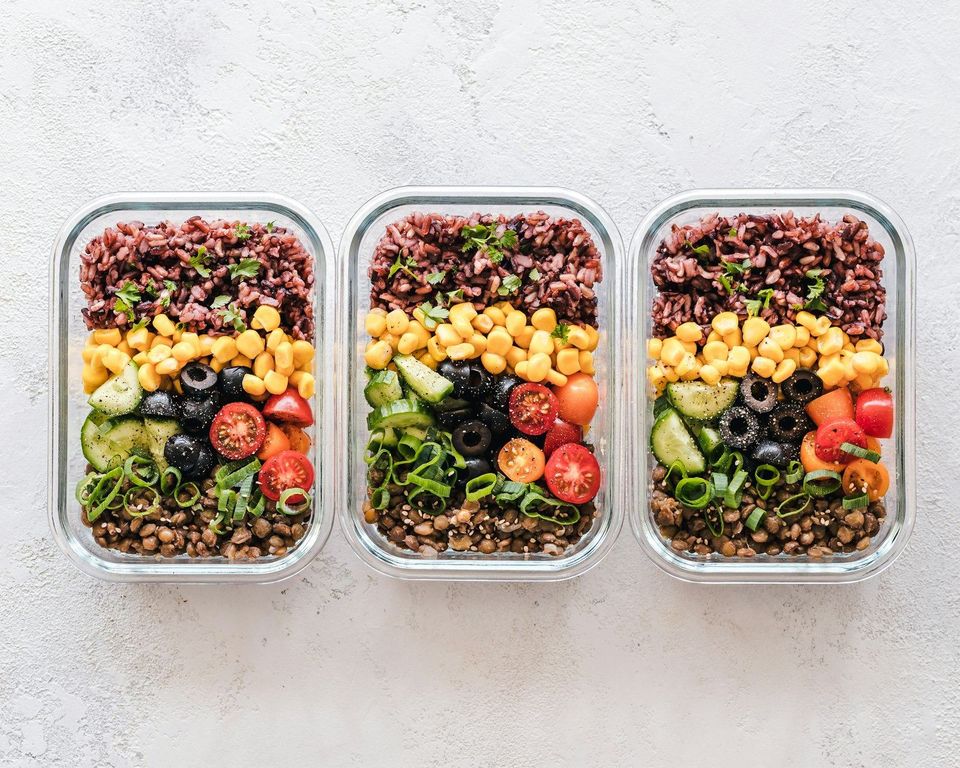 Three prepared meals in glass containers